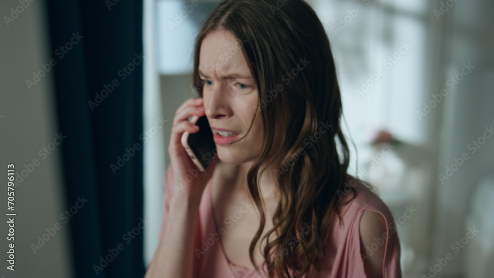Annoyed girl talking cell at night home closeup. Furious woman hang up ending Annoyed girl talking cell at night home closeup. Furious woman hang up ending