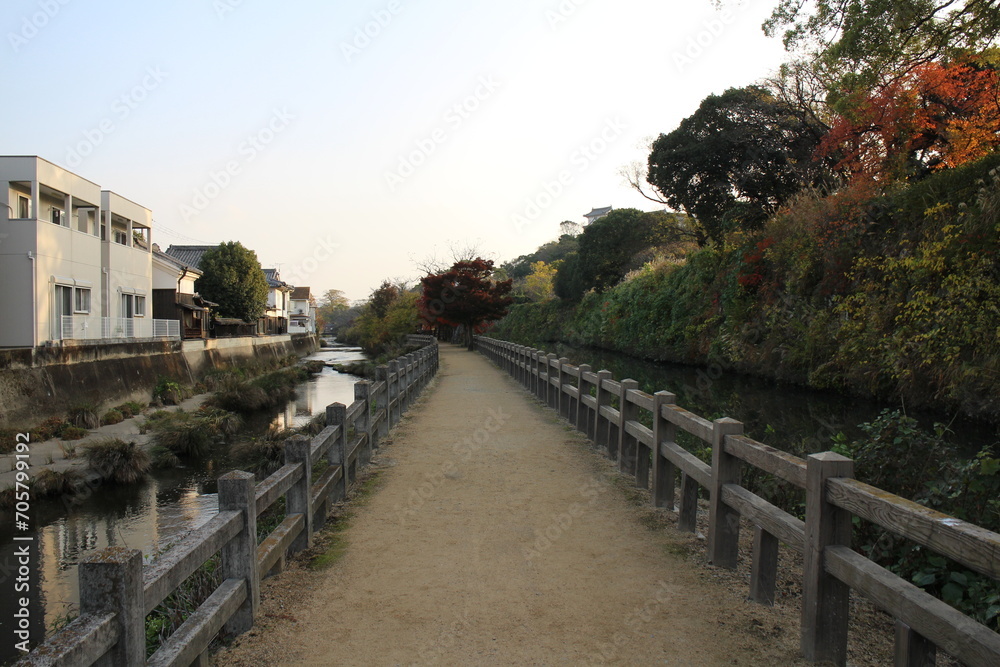 Senhime's path and autumn leaves in the early morning in Himeji, Japan