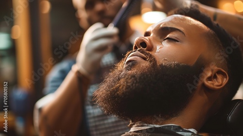 man at a barbershop salon doing haircut and beard trim    photo