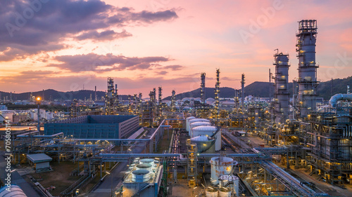 Oil and gas industrial refinery at twilight, Oil refinery and Petrochemical plant pipeline steel, Refinery factory oil storage tank and pipeline steel at night. photo