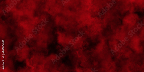 Red powder explosion cloud on black background.abstract Halloween or Christmas cloudy banner,used as a background in abstract style. 