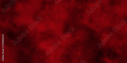Red powder explosion cloud on black background.abstract Halloween or Christmas cloudy banner,used as a background in abstract style.

