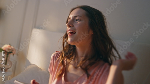 Happy woman reading sms in morning closeup. Excited attractive female holding