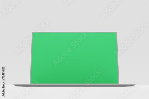 Modern laptop with a green screen on a white background ready for chroma key. 3D illustration