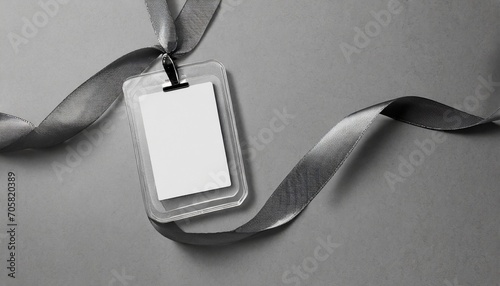 blank badge mockup on grey clipping path name tag with ribbon corporate design photo