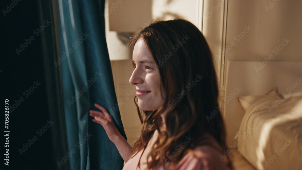 Morning girl open curtains in bedroom closeup. Smiling woman wake up on sunrise Morning girl open curtains in bedroom closeup. Smiling woman wake up on sunrise