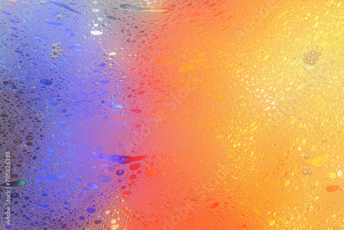 Macro shot of water-oil emulsion over colored background photo