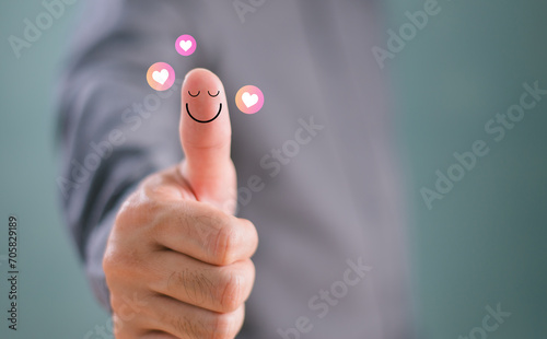 Customer experience compliment concept. Thumb up happy smile face, good feedback rating positive customer review, mine satisfaction survey, mental health assessment, feeling good mental health day photo