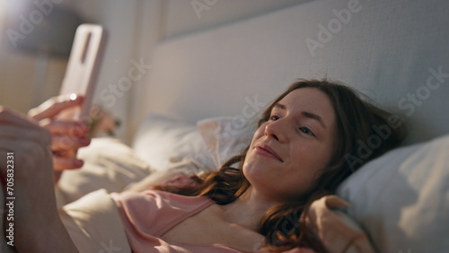 Tableau sur toile Closeup relaxed girl videocalling in bed