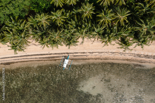 Boat stranded on a paradise beach photo