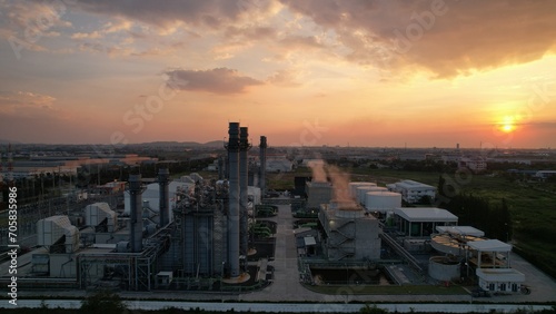 Power Plant electricity power supply factory against sunset sky