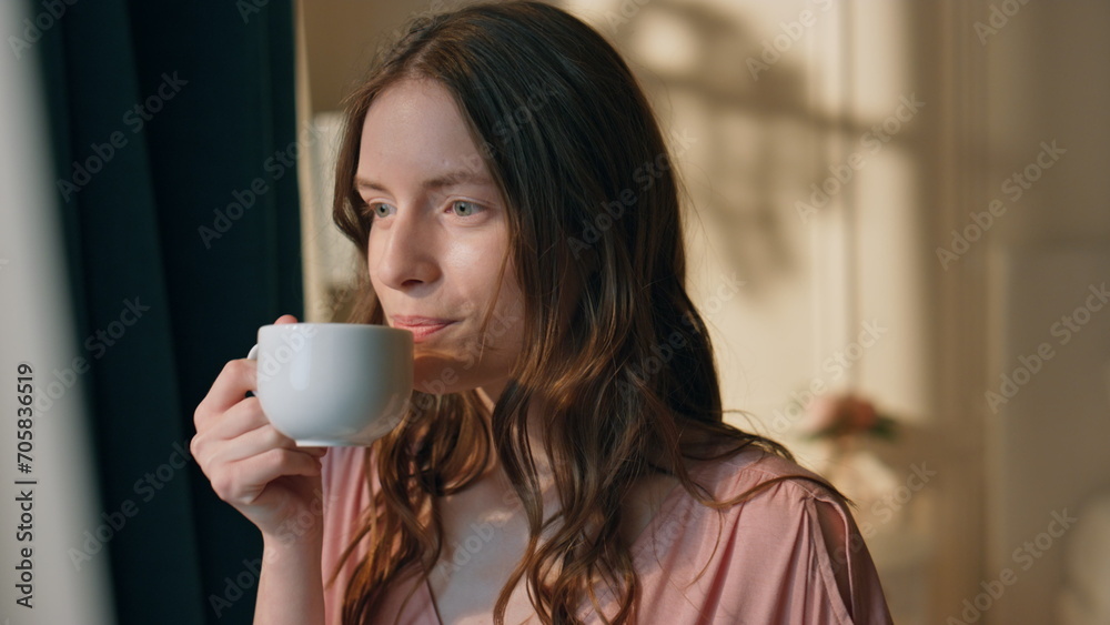 Peaceful woman drinking coffee in morning sunlight closeup. Dreamy girl thinking Peaceful woman drinking coffee in morning sunlight closeup. Dreamy girl thinking