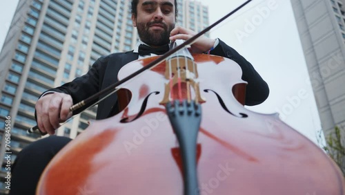 man playing the cello photo