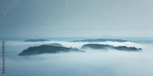 dense fog enveloping an archipelago, hauntingly beautiful, hints of islands emerging © Marco Attano