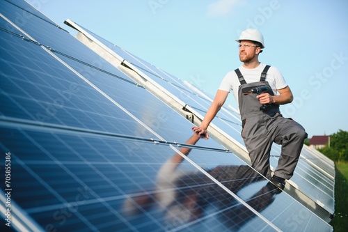 Wallpaper Mural Worker installing solar panels outdoors. Torontodigital.ca