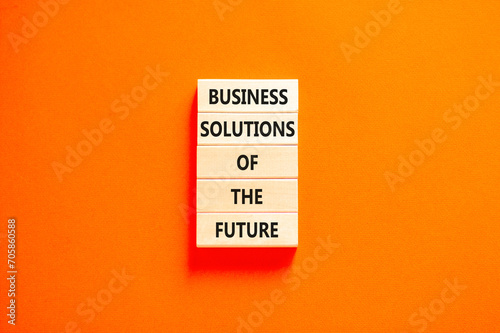 Business solutions of the future symbol. Concept words Business solutions of the future on wooden blocks. Beautiful orange table orange background. Business solutions of the future concept. Copy space