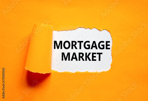 Mortgage market symbol. Concept words Mortgage market on beautiful white paper. Beautiful orange paper background. Business mortgage market concept. Copy space.