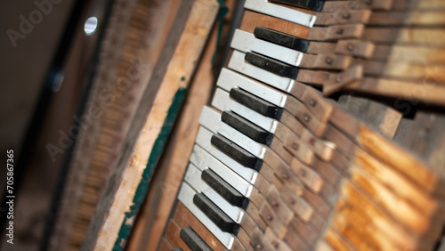 keys. black and white keys of an old piano. details of a musical instrument. close-up. disassembled, broken keyboard instrument, piano or grand piano, wood parts. vintage, retro. view from above