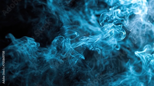 Blue coloured smoke abstract lighting on a black background. Background of smoke vape