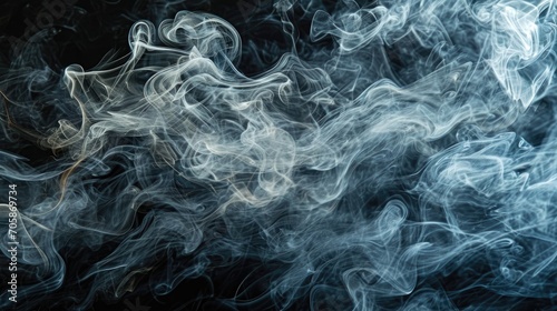 Abstract smoke moves on a black background. Background from the smoke of vape