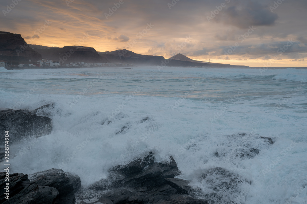 Fototapeta premium Quintanilla beach seascape at sunset with big waves. Arucas. Gran Canaria. Spain