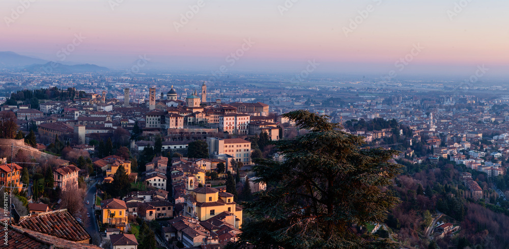 Fototapeta premium Panoramic view of cityscape Bergamo, aerial view to the city in the mountain valley, Lombardy, Italy.