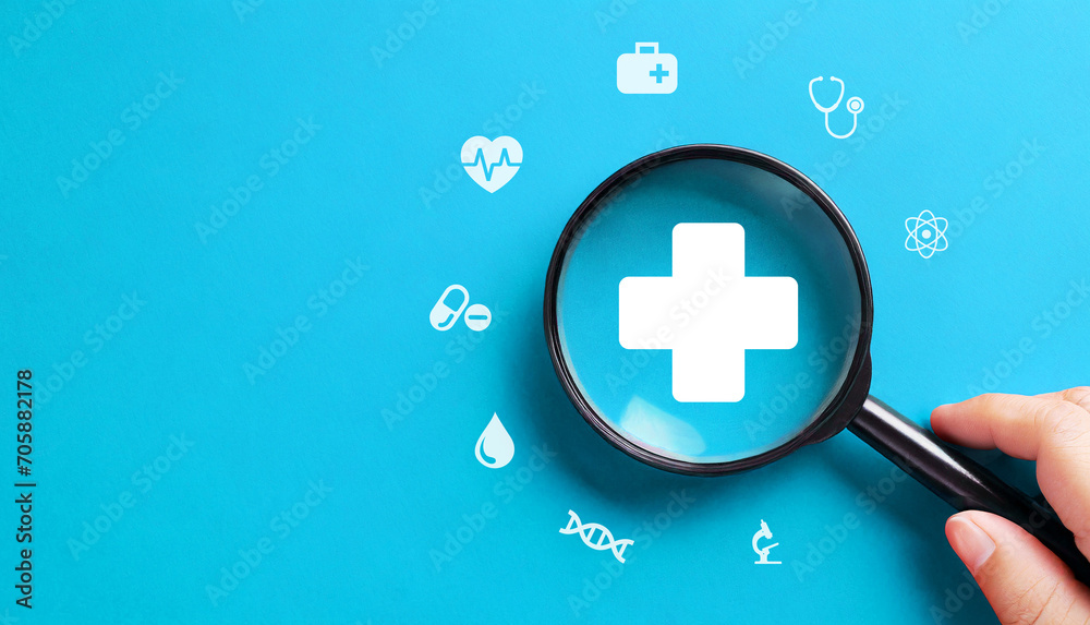 Health insurance concept with magnifying glass on blue background - obrazy, fototapety, plakaty 