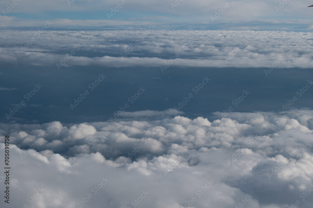 View of clouds from a airplane window at a sunny day View of clouds from a airplane window at a sunny day