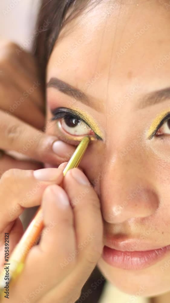 Video of young girl being made up, painted eyes. Concept of people and beauty. Video of young girl being made up, painted eyes. Concept of people and beauty.