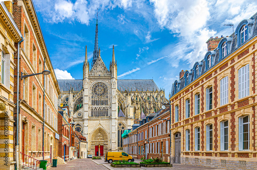 Fototapeta Naklejka Na Ścianę i Meble -  Amiens Cathedral Basilica of Our Lady Notre-Dame and pedestrian street with traditional buildings in old historical city centre, cityscape Amiens landmarks, Hauts-de-France Region, Northern France
