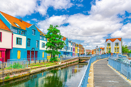 Colorful houses of Amiens historical city centre Saint-Leu quarter near water canal of Somme river. Multicolored buildings on embankment of old French town, Hauts-de-France Region, Northern France
