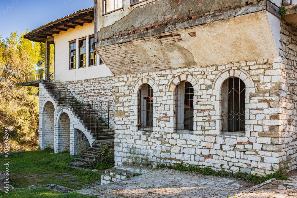 Abandoned house with architecture typical of Mediterranean countries. Old stone house in rural Albanian countryside