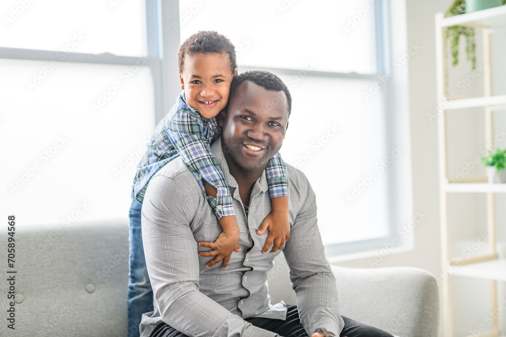 Happy Black American father with little boy at home Happy Black American father with little boy at home