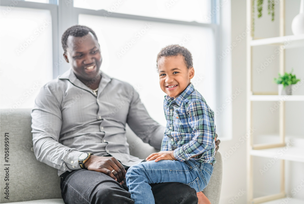 Happy Black American father with little boy at home Happy Black American father with little boy at home