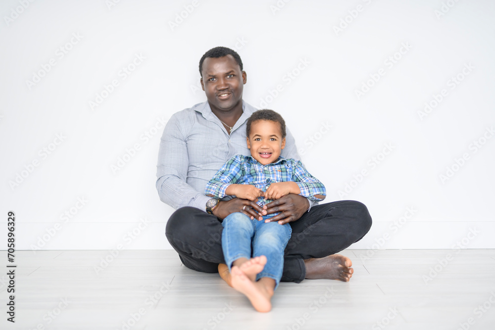 Happy Black American father with little boy at home Happy Black American father with little boy at home