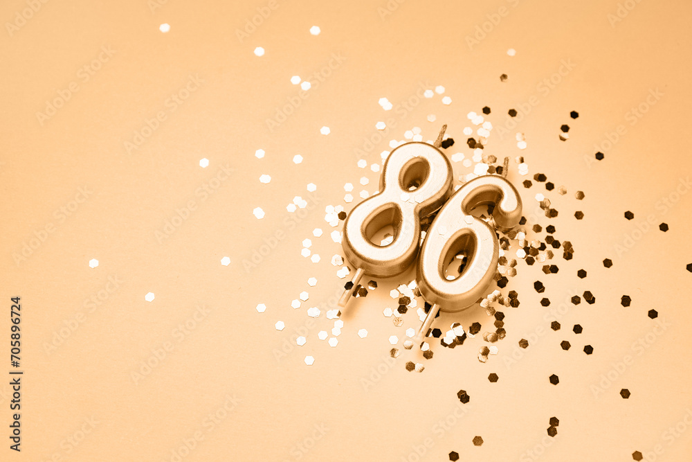 86 years celebration festive background made with golden candles in the ...