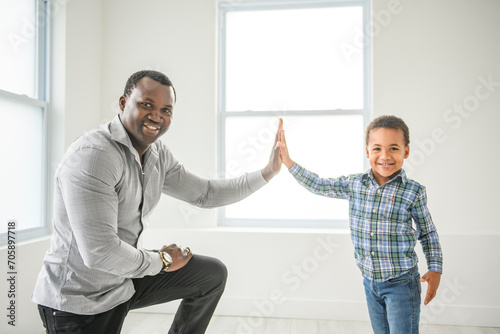 Happy American father with little boy at home