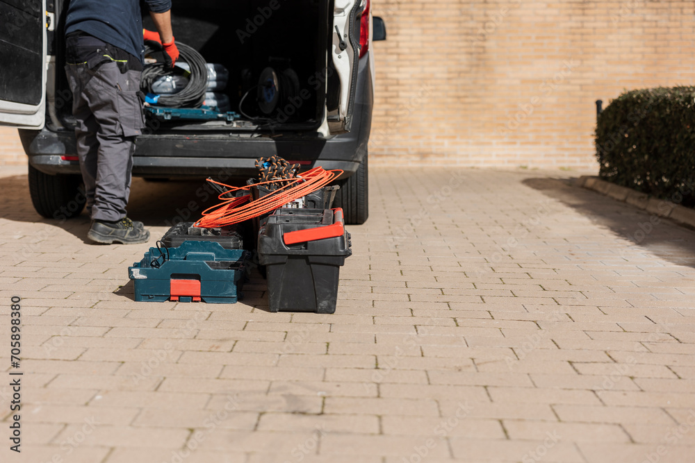 Fototapeta premium van with construction material worker unloading