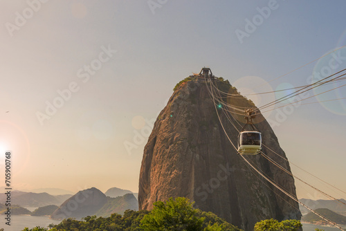 Rio de janeiro Brazil. Sugarloaf Mountain. Cable car crossing to Urca hill. In the background, the mountains and the beach of Niterói. photo