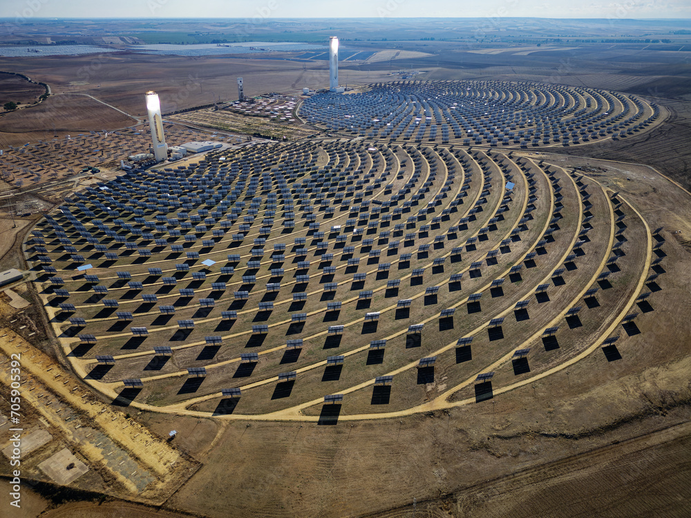Aerial view of the Solar Power Towers PS10 and PS20 in Sanlúcar la Mayor, Seville. Spain's stunning solar energy plant. Concentrated solar power plant. Renewable energy. Green energy.