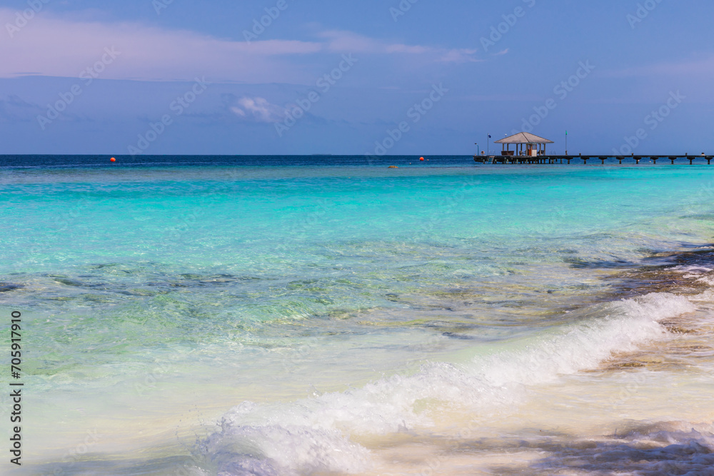 Azure water in the lagoon of the tropical island in the Maldives