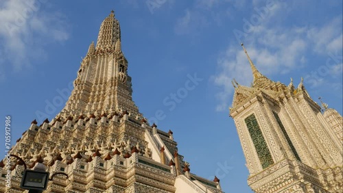 Time lapse of Prang (Khmer-Style Tower) at Temple of the Dawn (Wat Arun). Wat Arun is a most famous travel destinations in Bangkok and Thailand. It is located next to Chao Phraya River in Bangkok.  

 photo