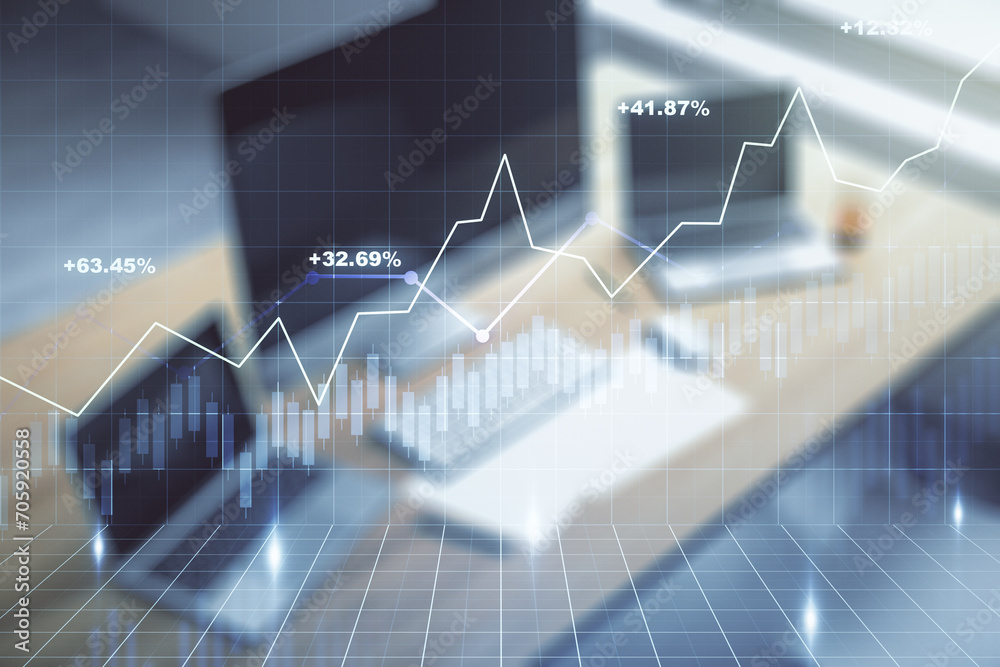 Multi exposure of abstract financial graph and modern desktop with pc on background, financial and trading concept Multi exposure of abstract financial graph and modern desktop with pc on background, financial and trading concept