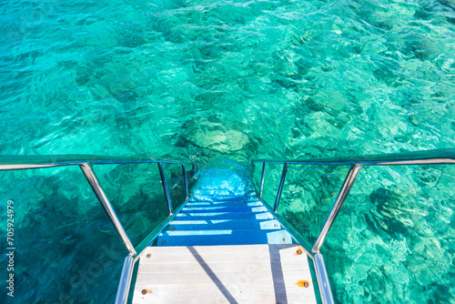 staircase leading into the ocean on an island resort in the Maldives