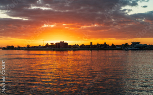 Sun rising over the Mississippi River from the French Quarter of New Orleans © steheap
