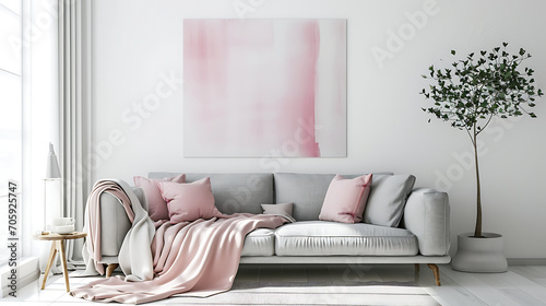 Grey sofa with pink pillows and blanket against white wall with abstract art poster. Interior design of modern living room