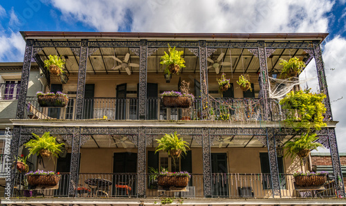 Halloween decorations on tradional New Orleans building in the French Quarter with wrought iron balconies photo