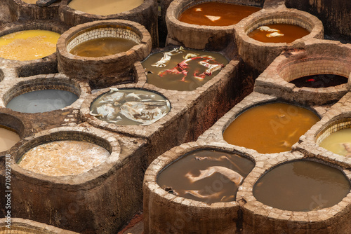 Old tanks of the Fez tanneries with color paint for leather, Morocco. photo