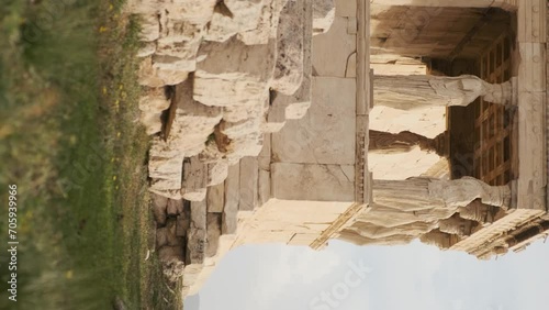 Caryatids statues at Erechtheion temple in Acropolis of Athens, Greece. Erechtheum is an ancient Greek Ionic temple in Greece. Vertical orientation photo