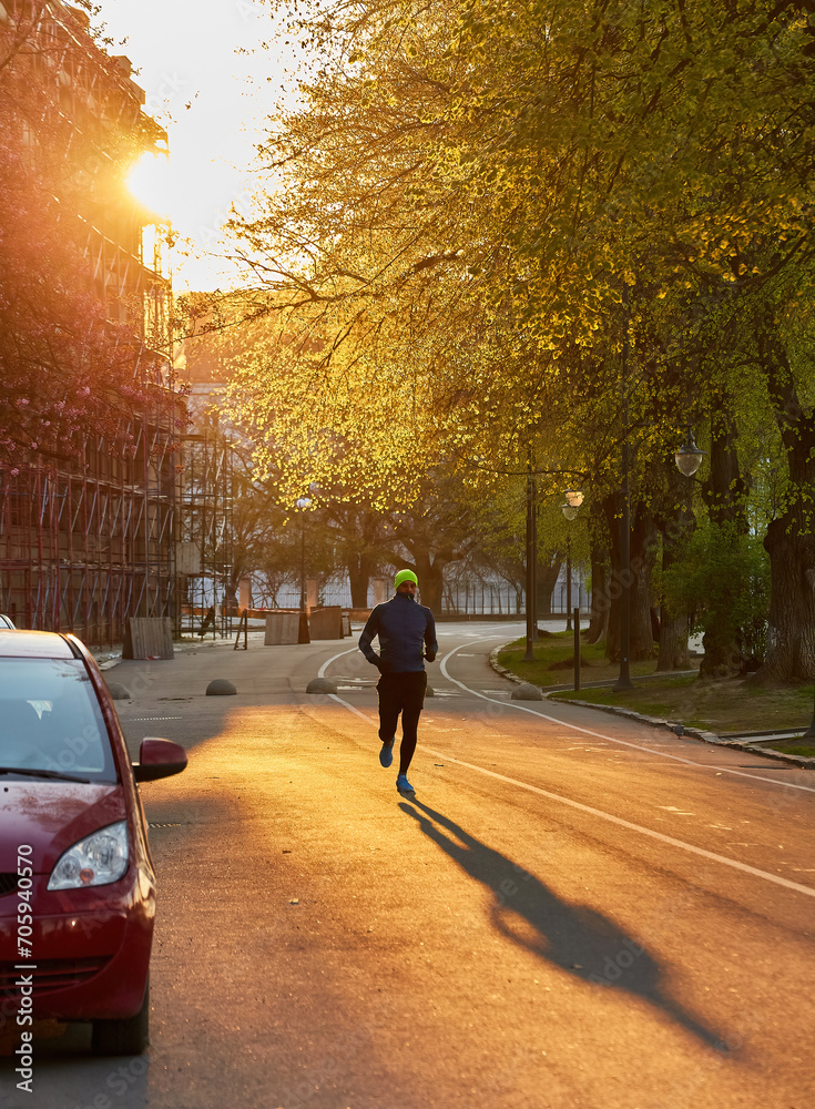 healthy athlete man jogging at morning on empty